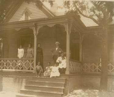 Home of an African American lawyer, Atlanta, Georgia, with men, women, and children posed on porch of house