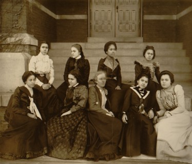 Nine African American women, full-length portrait, seated on steps of a building at Atlanta University, Georgia