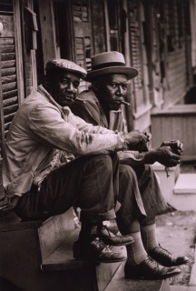 Two African American men sitting on stoop