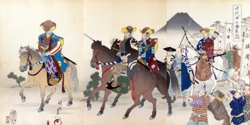 Samurai horsemen & archers ride horses with a backdrop of Mt. Fuji