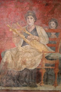 Seated woman playing a kithara
