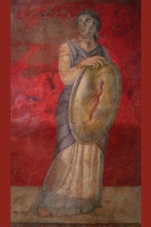 Standing woman holding a shield