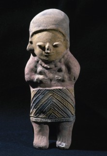 Female figure with polychrome remains.