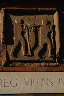 Pompeii. Relief depicting two men carrying an amphora.