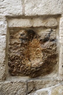 Stone with the print of hand of Jesus.