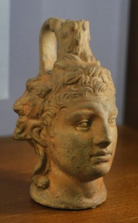 Figured vessel: Head of young Heracles.