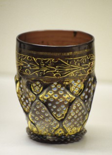 Transparent violet glass wares with enamel painted and gilt.
