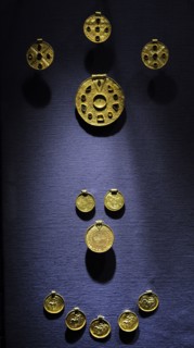 4 medaillons, 17 bracteates and a sword scabbard mount.