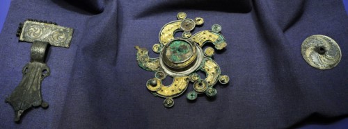 Solar cross brooch.