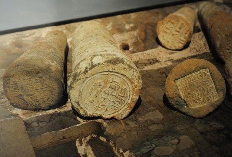 Funeray cones with the name and title of the deceased written in hieroglyphs.