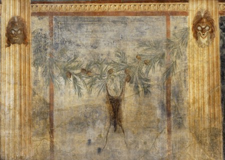 Goatskin hanging from a pine garland.