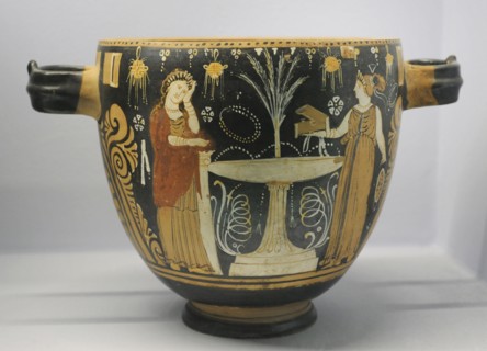 Pyxis depicting two women in a toilette next to a louterion.
