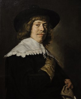A Young Man Holding a Glove.