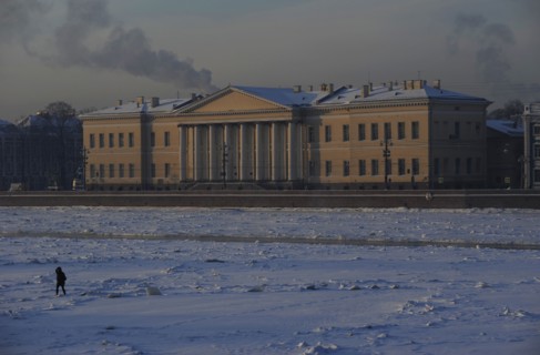 Person walking on the frozen Neva river during the winter surface.