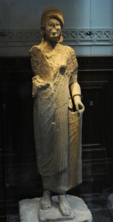Statue of a young woman with linen dress