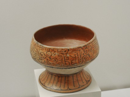 Cup with schematic and geometric decoration