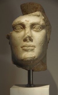Head of young man with helmet, c