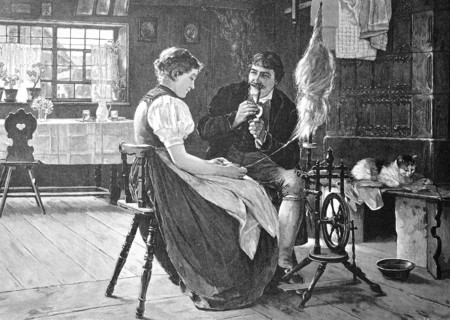 The couple sits together in the living room