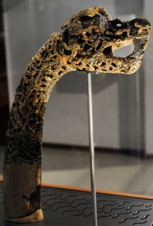 Animal-head post carved in wood