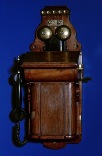 Manual telephone switchboard with handset.