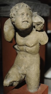 Sculpture depicting children playing piggyback horse.
