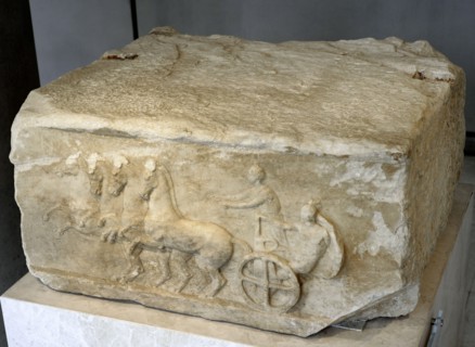 Base of a dedication. Scene from the apobates race.