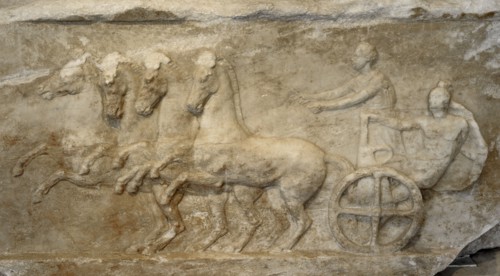 Base of a dedication. Scene from the apobates race.