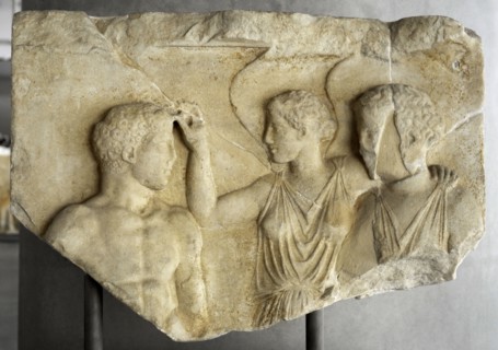 Dedication. Winged Nike crowns Herakles or athlete before Athena.