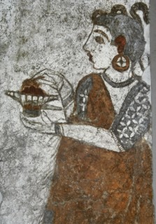 Priestess making offerings.