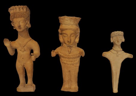 Male and female terracottas in a prayerful attitude
