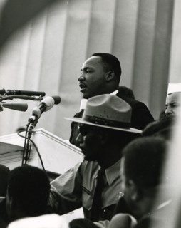 MLK, Jr. speaking to the crowd on the steps of the Lincoln Memorial
