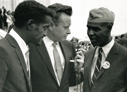 Actor Sammy Davis, Jr and Roy Wilkins being interviewed