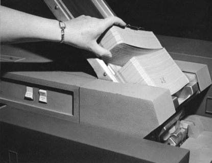 Punched Data Cards Fed Into Processor
