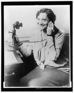 1930 - Ruth Hanna McCormick smiling while holding a telephone