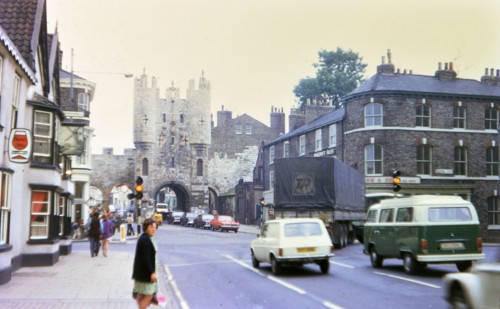 Woman waiting to cross the street in York England circa 1973.