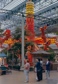 Women watch their children and grandchildren on a ride at the Mall of America circa 1994-1996.