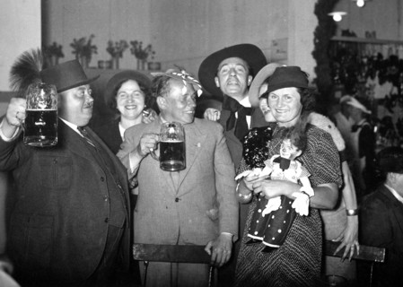 German men drinking beer and celebrating circa 1930s (possibly around Christmas or New Years) .
