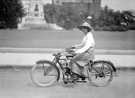 Woman riding bicycle in 1917 or 1918 .