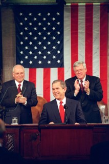 Vice President Dick Cheney and House Speaker Dennis Hastert applaud President George W. Bush Feb. 27, 2001, during a speech to a Joint Session of Congress in the House chamber..