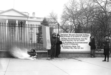 Woman Suffrage Movement - Bonfire on the sidewalk in front of the White House circa 1918 .