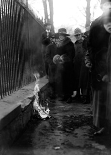 Woman Suffrage Movement - Bonfire on the sidewalk in front of the White House circa 1918 .