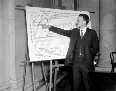 F.G. Tryon, of the market statistics unit of the National Bituminous Coal Commission pointing to a chart circa 1938.