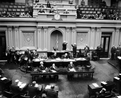 Scene in the United States Senate chamber as Vice President Garner administers the oath to Senator Elmer Thomas, re-elected from Oklahoma in last November's election circa 1/4/1939.