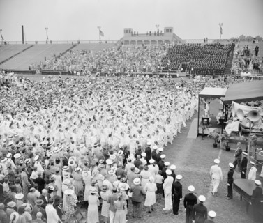 With a mighty heave graduates of the U.S. Naval Academy in Annapolis toss their midshipmen's caps into the air after receiving their commissions as ensigns circa 1939.