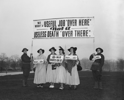 Anti-war protesters against World War II holding signs circa 1940 .