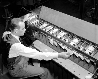 Man working Card sorter for tabulating machine circa 1940.