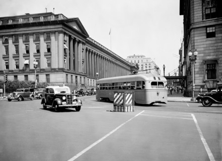 Cars and bus on Pennsylvania Avenue and 15th Street in Washington D.C. circa July 1936.