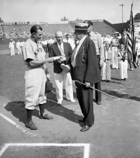 Jake Powell, New York Yankee outfielder, was presented with a wallet today as a token of esteem from fans of Laurel, MD, where he played as a semipro circa 1937.