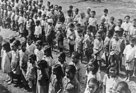 Ambarawa: The Dutch Indian school was festively opened on 20 September. The children listen to the teacher circa September 20, 1947 / Location Indonesia, Dutch East Indies.