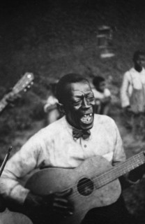 Stavin' Chain playing guitar and singing the ballad 'Batson,' Lafayette, La. June 1934.